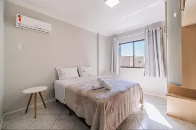 Uma cama ou camas num quarto em Achei Itapema • Nápoli Residencial, R.224