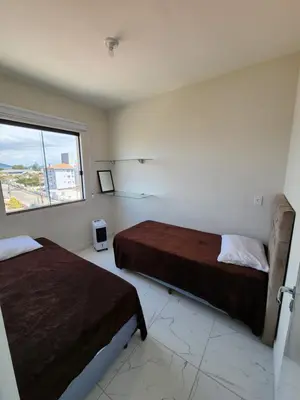 Uma cama ou camas num quarto em apartamento