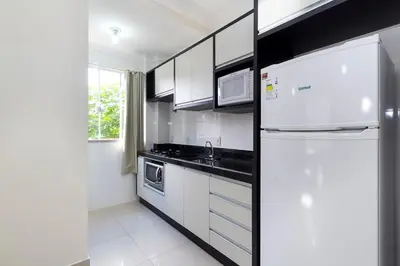 A cozinha ou kitchenette de Apartamento Bombinhas próximo à praia