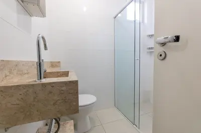 Uma casa de banho em Apartamento Bombinhas próximo à praia