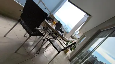 Uma varanda ou terraço em Linda Cobertura Bombinhas - perto PRAIA- AR Condicionado em todos ambientes Churrasqueira - Comporta 10 pessoas