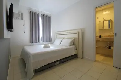 Uma cama ou camas num quarto em Cobertura Solar das gaivotas