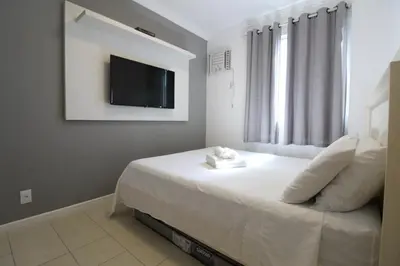 Uma cama ou camas num quarto em Cobertura Solar das gaivotas