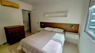 Uma cama ou camas num quarto em Jardim Cristal