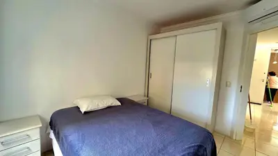 Uma cama ou camas num quarto em Jardim Cristal