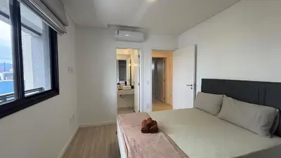 Uma área de estar em Apê Central | 2 Suítes + A/C + Vista Mar