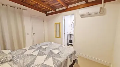Uma cama ou camas num quarto em Casa com acesso praia de Zimbros