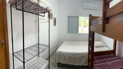 Uma cama ou camas num quarto em Casa de praia em Palmas, com piscina, 250m do mar