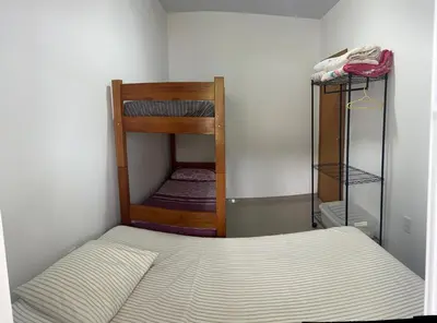Uma cama ou camas num quarto em Casa de praia em Palmas, com piscina, 250m do mar