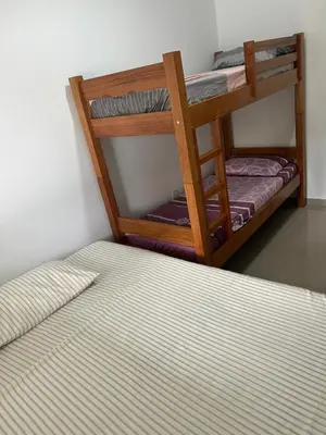 Uma cama ou camas num quarto em Casa de praia em Palmas, com piscina, 250m do mar