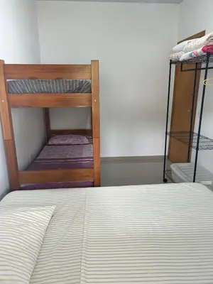 Uma cama ou camas num quarto em Casa de praia em Palmas, com piscina, 250m do mar
