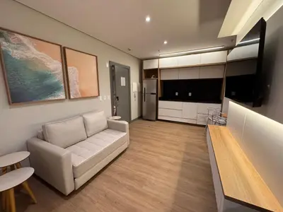 Uma televisão e/ou sistema de entretenimento em Flats New York Meia Praia Itapema