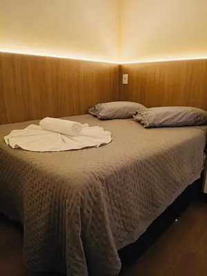 Uma cama ou camas num quarto em Flats New York Meia Praia Itapema
