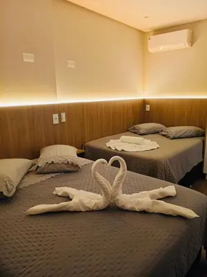 Uma cama ou camas num quarto em Flats New York Meia Praia Itapema