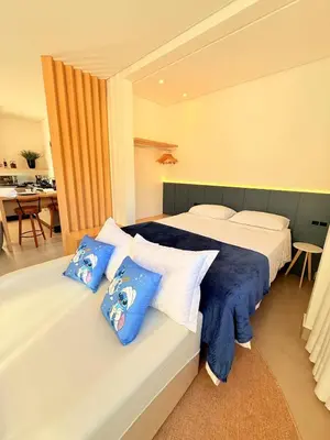 Uma cama ou camas num quarto em Studio Luxo • Serra BC & Itapema