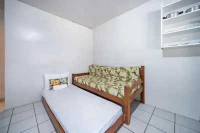 Uma cama ou camas num quarto em Mares e Flores de Bombinhas