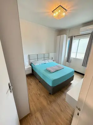 Uma cama ou camas num quarto em 90 metros do MAR! 3 quartos, 1 suite, 2 vagas de garagem