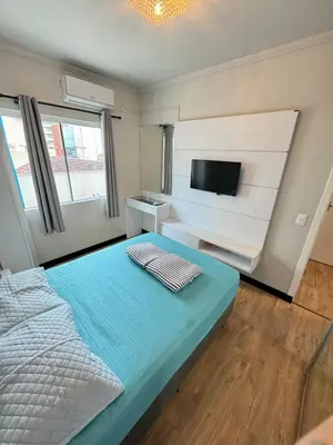 Uma cama ou camas num quarto em 90 metros do MAR! 3 quartos, 1 suite, 2 vagas de garagem