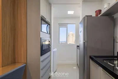 A cozinha ou kitchenette de Apartamentos a 400m da Praia em Itapema - CARA
