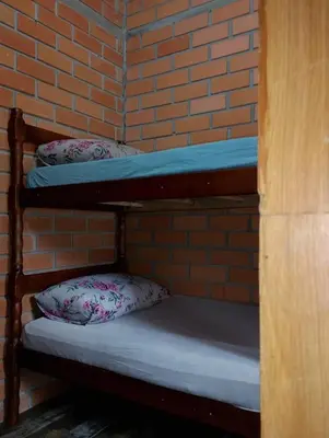 Uma cama ou camas num quarto em Kitnet 2 quartos Porto Belo, perto da praia