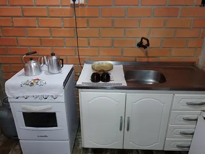 A cozinha ou kitchenette de Kitnet 2 quartos Porto Belo, perto da praia