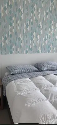 Uma cama ou camas num quarto em Apê de fundos em condo beira mar com garagem e Wi-Fi