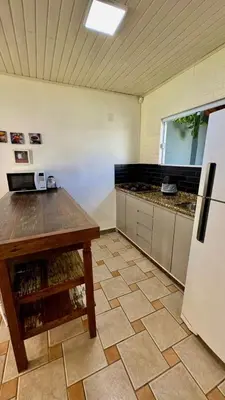 A cozinha ou kitchenette de Casa Sal - Com Piscina - Praia de Mariscal-SC