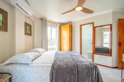Uma cama ou camas num quarto em Apto 03 quartos | Canto Grande