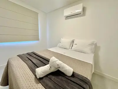 Uma cama ou camas num quarto em Achei Itapema • Novara Residencial, Perequê PB/SC