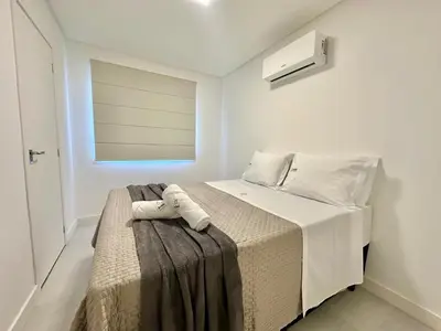 Uma cama ou camas num quarto em Achei Itapema • Novara Residencial, Perequê PB/SC
