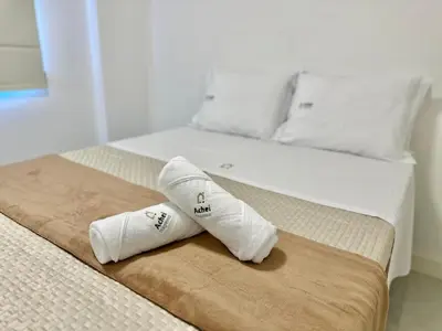 Uma cama ou camas num quarto em Achei Itapema • Novara Residencial, Perequê PB/SC