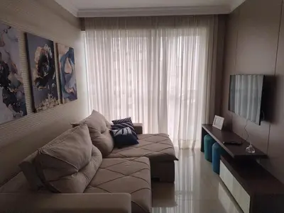 Uma televisão e/ou sistema de entretenimento em Apartamento de luxo em Meia Praia