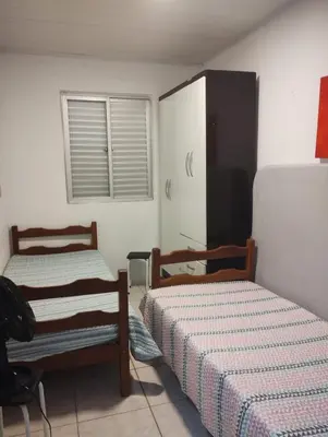 Uma cama ou camas num quarto em casa da vovó