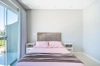 Uma cama ou camas num quarto em Casa 02 | 2 suítes | até 7 pessoas