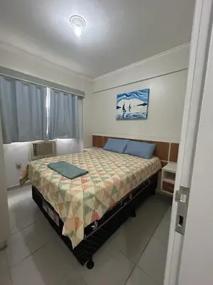 Uma cama ou camas num quarto em Clube do Mar-Rua 224 Itapema Meia Praia Apt 104 B