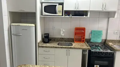 A cozinha ou kitchenette de Clube do Mar-Rua 224 Itapema Meia Praia Apt 104 B