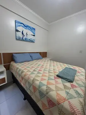 Uma cama ou camas num quarto em Clube do Mar-Rua 224 Itapema Meia Praia Apt 104 B