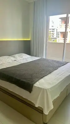 Uma cama ou camas num quarto em Aconchegante Apartamento com Piscina