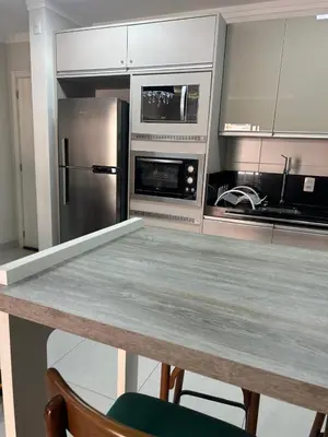 A cozinha ou kitchenette de Aconchegante Apartamento com Piscina
