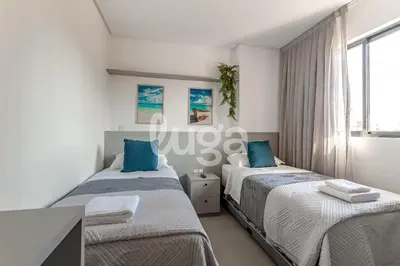 Uma cama ou camas num quarto em Conforto & Lazer – Oásis de Itapema