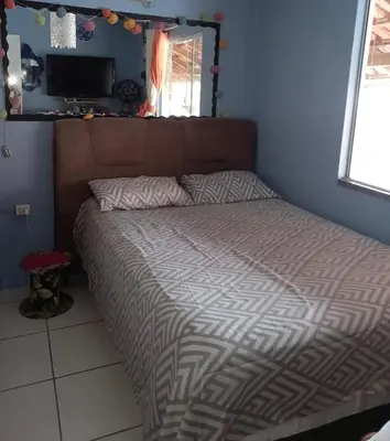 Uma cama ou camas num quarto em Casa para descanso