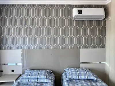 Uma cama ou camas num quarto em B483 - Apartamento de 3 quartos próximo à praia