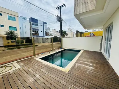 A piscina em ou perto de Palm Beach Residence – Apartamento espaçoso com 3 suítes na Praia de Palmas para até 8 pessoas.