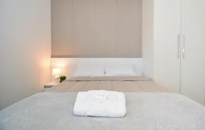 Uma cama ou camas num quarto em Encanto de Palmas a Poucos Passos do Mar - GCR009