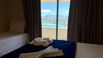 Uma cama ou camas num quarto em Oasis do Mar Hotel - A melhor vista de Itapema