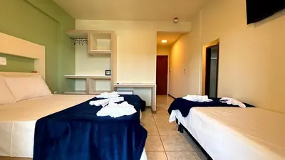 Uma cama ou camas num quarto em Oasis do Mar Hotel - A melhor vista de Itapema