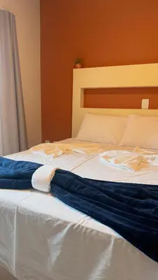 Uma cama ou camas num quarto em Oasis do Mar Hotel - A melhor vista de Itapema