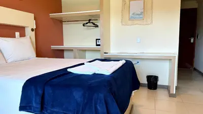 Uma cama ou camas num quarto em Oasis do Mar Hotel - A melhor vista de Itapema