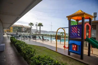A piscina em ou perto de Condomínio Frente Mar com Piscina