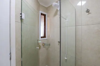 Uma casa de banho em Aconchegante apartamento no Centro de Bombinhas
